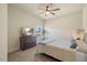 An inviting bedroom with a ceiling fan, neutral colors, and a nice view from the window at 99 Preserve Dr, Benson, NC 27504