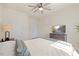 Bedroom featuring neutral walls, a ceiling fan, and a dresser with a television at 99 Preserve Dr, Benson, NC 27504