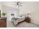 Cozy bedroom with neutral walls, carpet, ceiling fan, and natural light from the window at 99 Preserve Dr, Benson, NC 27504