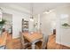 Open dining area with hardwood floors, pendant lighting, and seamless flow to the living spaces at 99 Preserve Dr, Benson, NC 27504