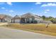 Charming single-story home with a three-car garage and well-manicured lawn at 99 Preserve Dr, Benson, NC 27504