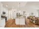 Modern open-concept kitchen featuring an island, granite countertops, and stainless steel appliances at 99 Preserve Dr, Benson, NC 27504