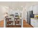 Stylish kitchen features an island with barstool seating and stainless steel refrigerator at 99 Preserve Dr, Benson, NC 27504