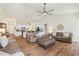 Spacious living room showcases hardwood floors, a ceiling fan, and open access to the kitchen at 99 Preserve Dr, Benson, NC 27504