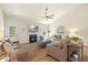 Cozy living room features a fireplace, leather sofas, and a ceiling fan at 99 Preserve Dr, Benson, NC 27504