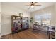 Comfortable office with natural light, hardwood floors, and well-placed bookshelves at 99 Preserve Dr, Benson, NC 27504