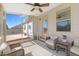 Enjoy outdoor living on this screened-in patio with wicker seating and backyard views at 99 Preserve Dr, Benson, NC 27504
