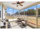 Relaxing screened-in patio with comfortable seating and an inviting view of the backyard at 99 Preserve Dr, Benson, NC 27504