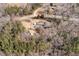 Expansive wooded property featuring a home, outbuildings and circular drive in a rural setting at 10611 Quail Roost Rd, Bahama, NC 27503