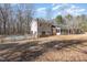 View of the house from the backyard, featuring a pool and multiple additions for extra living space at 10611 Quail Roost Rd, Bahama, NC 27503