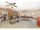 Spacious basement with vintage billiard table, exposed brick wall, and ceiling fans at 10611 Quail Roost Rd, Bahama, NC 27503
