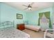 Light and airy bedroom featuring two twin beds, with a window at 10611 Quail Roost Rd, Bahama, NC 27503