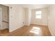 Bedroom with a closet, wood floors, and a window at 10611 Quail Roost Rd, Bahama, NC 27503