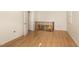 Bedroom featuring wood floors and a window at 10611 Quail Roost Rd, Bahama, NC 27503