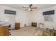Spacious bedroom featuring carpeted floors, windows and a ceiling fan at 10611 Quail Roost Rd, Bahama, NC 27503