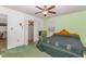 Cozy bedroom featuring a ceiling fan and closet for storage at 10611 Quail Roost Rd, Bahama, NC 27503