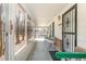 The front porch features decorative metal door and a screened view to the property's mature trees at 10611 Quail Roost Rd, Bahama, NC 27503