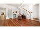 Inviting living room features a fireplace, hardwood floors, and access to the staircase at 114 W Lynch St, Durham, NC 27701