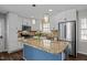 Kitchen featuring island, stainless steel appliances, and white cabinets at 1195 Champion Dr, Cary, NC 27511