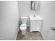 Compact bathroom features a toilet and a sink with new fixtures at 1216 Armstrong Cir, Raleigh, NC 27610
