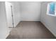 Cozy bedroom features neutral carpet and a window at 1216 Armstrong Cir, Raleigh, NC 27610