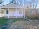 Charming single-story home featuring a covered front porch and a mix of siding and brick accents at 1216 Armstrong Cir, Raleigh, NC 27610