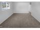 Spacious living room features neutral carpet and a bright window at 1216 Armstrong Cir, Raleigh, NC 27610