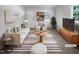 Bright living room featuring stylish furniture, neutral tones, and a large window at 1216 Armstrong Cir, Raleigh, NC 27610