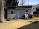 Backyard outbuilding with ample storage space and potential for workshop or hobby area at 1218 W Pearsall St, Dunn, NC 28334