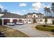 Grand home with circular driveway, manicured lawn, and ample parking for guests at 1326 Lochshire Dr, Burlington, NC 27215