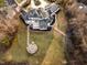Aerial view of grand home showcasing an outdoor fire pit and surrounding landscaping at 1326 Lochshire Dr, Burlington, NC 27215