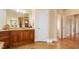 Bathroom featuring custom vanity, large mirror, and tile flooring at 1326 Lochshire Dr, Burlington, NC 27215