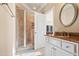 Bathroom with glass enclosed shower and a vanity with marble countertop at 1326 Lochshire Dr, Burlington, NC 27215