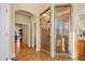Elegant bathroom featuring a tiled shower and an arched doorway leading to other rooms at 1326 Lochshire Dr, Burlington, NC 27215