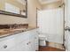 Traditional bathroom featuring a vanity with granite countertops and shower with a curtain at 1326 Lochshire Dr, Burlington, NC 27215