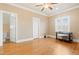 Spacious bedroom with ample natural light, hardwood flooring, and a convenient ensuite bathroom at 1326 Lochshire Dr, Burlington, NC 27215