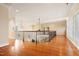 Spacious hallway with hardwood floors, an iron railing and chandelier, and an open view at 1326 Lochshire Dr, Burlington, NC 27215