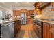Stylish kitchen showcasing stainless steel appliances, custom cabinets, and granite counters at 1326 Lochshire Dr, Burlington, NC 27215