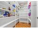 Walk-in pantry with white shelving, perfect for kitchen storage and organization at 1326 Lochshire Dr, Burlington, NC 27215