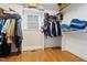 Well-organized walk-in closet with shelves, hanging rods, and natural light from a window at 1326 Lochshire Dr, Burlington, NC 27215