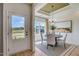Bright dining room with stylish chandelier, large window and outdoor view at 135 Baneberry Dr, Broadway, NC 27505