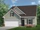 Charming two-story home with a two-car garage and a beautifully landscaped front yard at 135 Baneberry Dr, Broadway, NC 27505