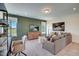 Comfortable living room with plush carpeting, modern furnishings, and abundant natural light at 135 Baneberry Dr, Broadway, NC 27505