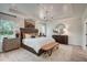 Relaxing main bedroom featuring a tray ceiling, stylish decor, and plenty of natural light at 135 Baneberry Dr, Broadway, NC 27505