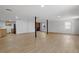 Finished basement space with laminate flooring, brick fireplace, and window views at 1411 Rosewood St, Durham, NC 27701