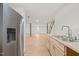 Spacious basement featuring light-colored wood flooring, stainless steel refrigerator, and butcher block countertops at 1411 Rosewood St, Durham, NC 27701