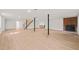 Finished basement space with fireplace, bar, stairs and laminate wood flooring at 1411 Rosewood St, Durham, NC 27701