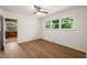 Bright bedroom with hardwood floors and a large window offering plenty of natural light at 1411 Rosewood St, Durham, NC 27701