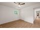 Bedroom with ceiling fan, hardwood floors and closet at 1411 Rosewood St, Durham, NC 27701