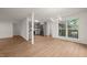 Living area flows into kitchen, featuring stainless steel appliances and ample natural light at 1411 Rosewood St, Durham, NC 27701